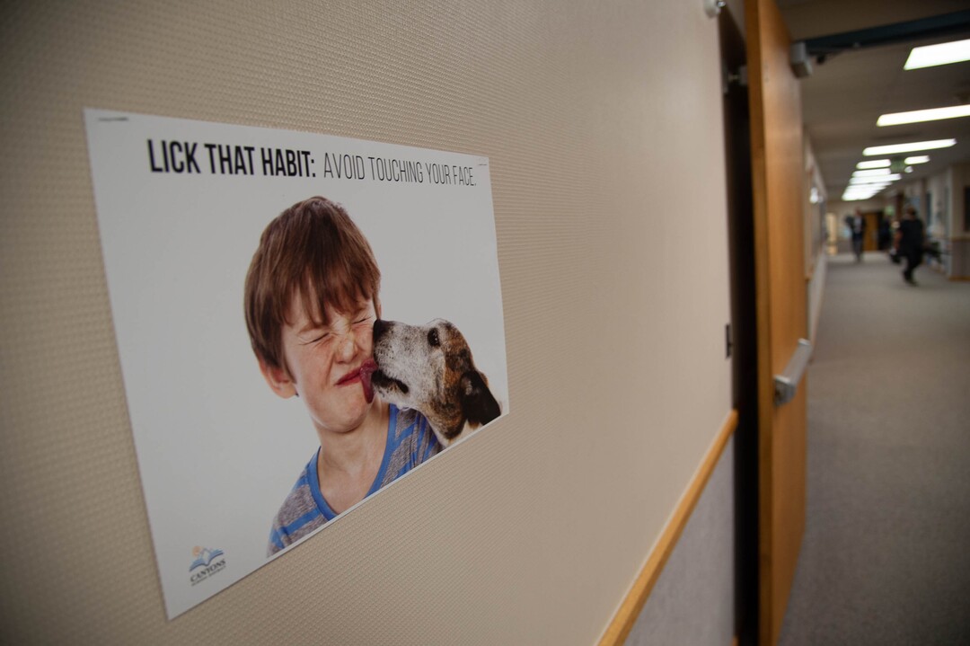 (Francisco Kjolseth  |  The Salt Lake Tribune) A poster encourages kids to avoid touching their face as students at Canyon View Elementary in Cottonwood Heights go back to school for the first day classes for the Canyons School District on Monday, August 24, 2020.