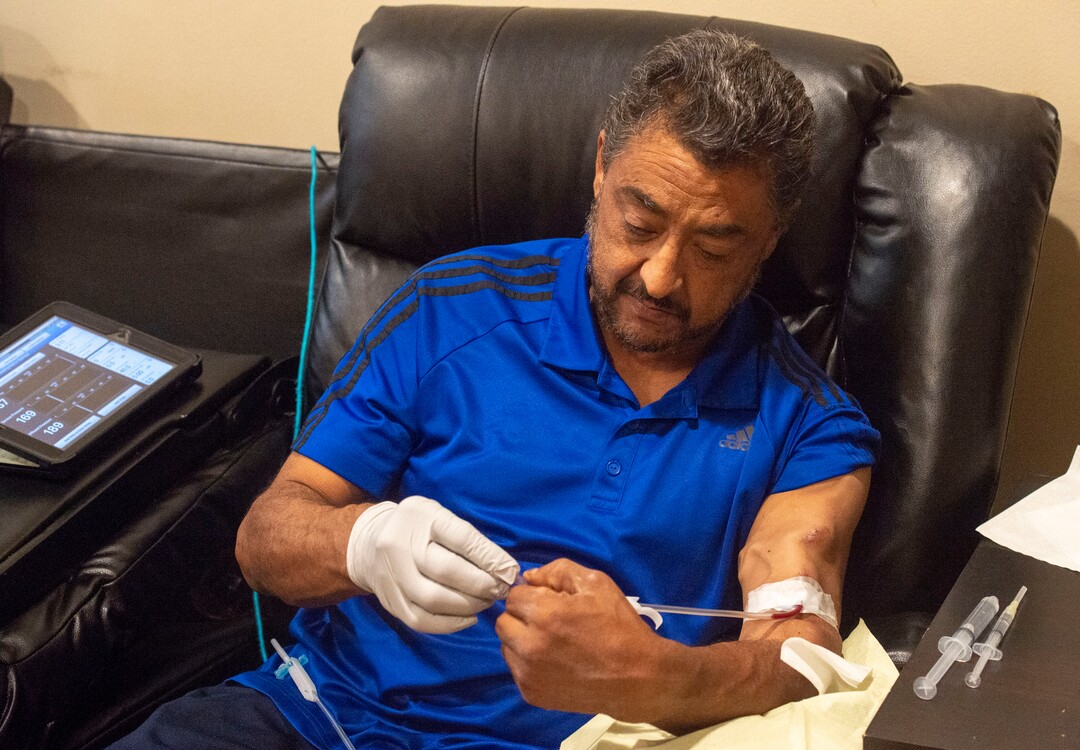 (Rick Egan  |  The Salt Lake Tribune)     Raul Gutierrez goes through the steps to setup his machine, as an in-home dialysis patient. Thursday, Sept. 5, 2019.