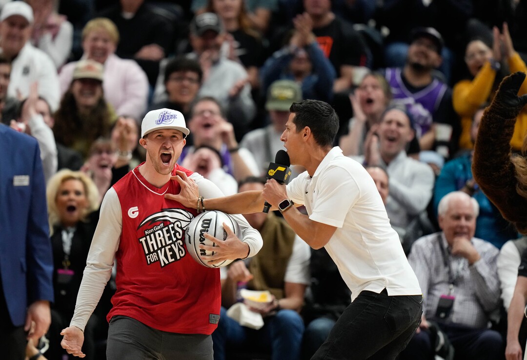 (Francisco Kjolseth  |  The Salt Lake Tribune) A Jazz fan celebrates winning a car after shooting three-point shots during a break in action between the Utah Jazz and the Cleveland Cavaliers at the Delta Center in Salt Lake City on Tuesday, April 2, 2024.