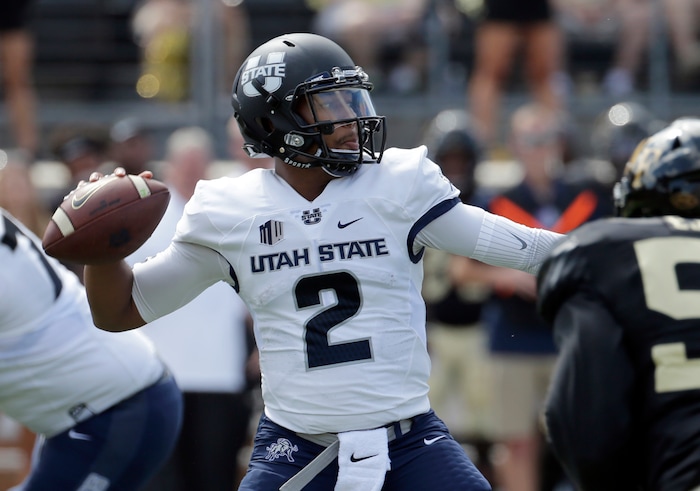 Utah State's Kent Myers (2) looks to pass against Wake Forest in the first half of an NCAA college football game in Winston-Salem, N.C., Saturday, Sept. 16, 2017. (AP Photo/Chuck Burton)