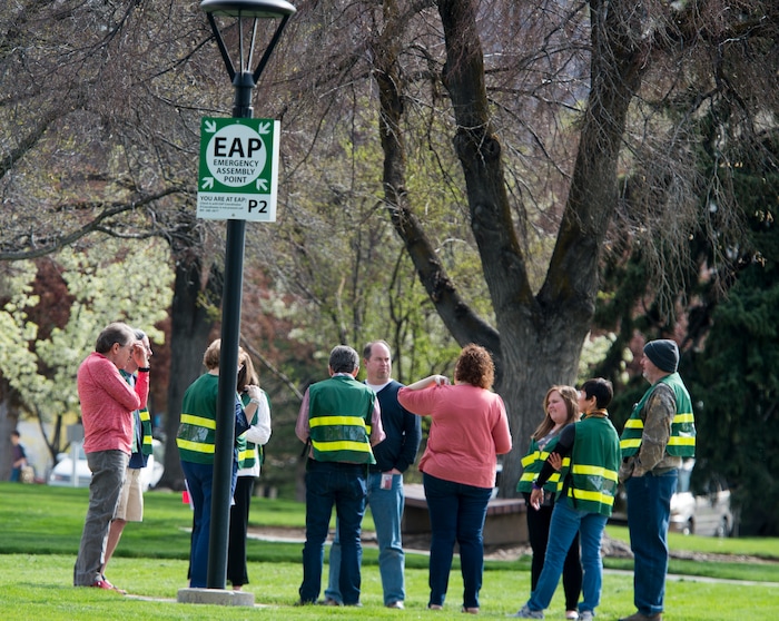 (Rick Egan | The Salt Lake Tribune) Emergency response captains wear their green vests as they meet at an emergency assembly point in Presidents Circle on the University of Utah campus, during the Great Utah ShakeOut Annual Statewide Earthquake Drill Thursday, April 19, 2018.