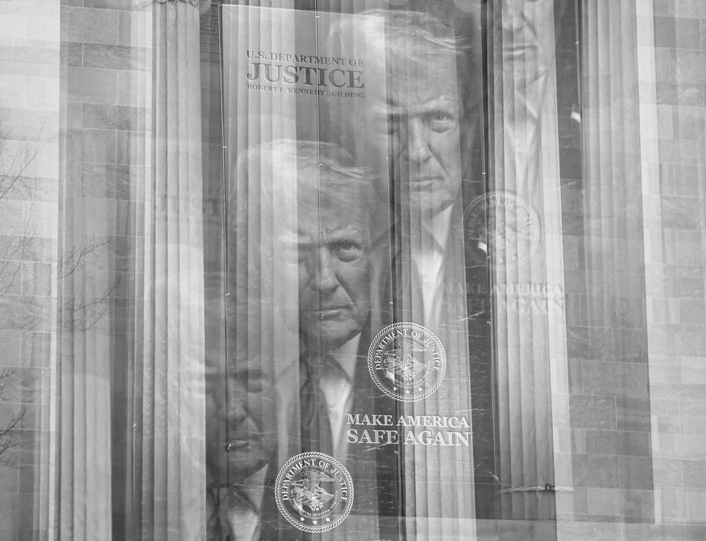 A Trump banner hanging from the J. Edgar Hoover Department of Justice Building in Washington, Feb. 25, 2026. (Damon Winter/The New York Times)