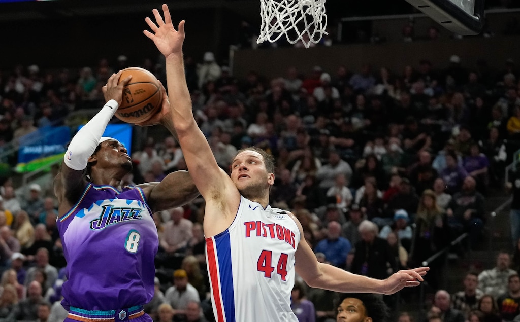 (Francisco Kjolseth | The Salt Lake Tribune) Utah Jazz forward Jarred Vanderbilt (8) is pressured at the basket by Detroit Pistons forward Bojan Bogdanovic (44) as the Utah Jazz take on the Detroit Pistons in NBA basketball at Vivint Arena in Salt Lake City on Wednesday, Nov. 23, 2022.