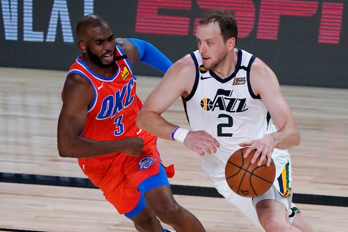 Utah Jazz's Joe Ingles (2) drives up the court against Oklahoma City Thunder's Chris Paul (3) during the first half of an NBA basketball game Saturday, Aug. 1, 2020, in Lake Buena Vista, Fla. (AP Photo/Ashley Landis, Pool)