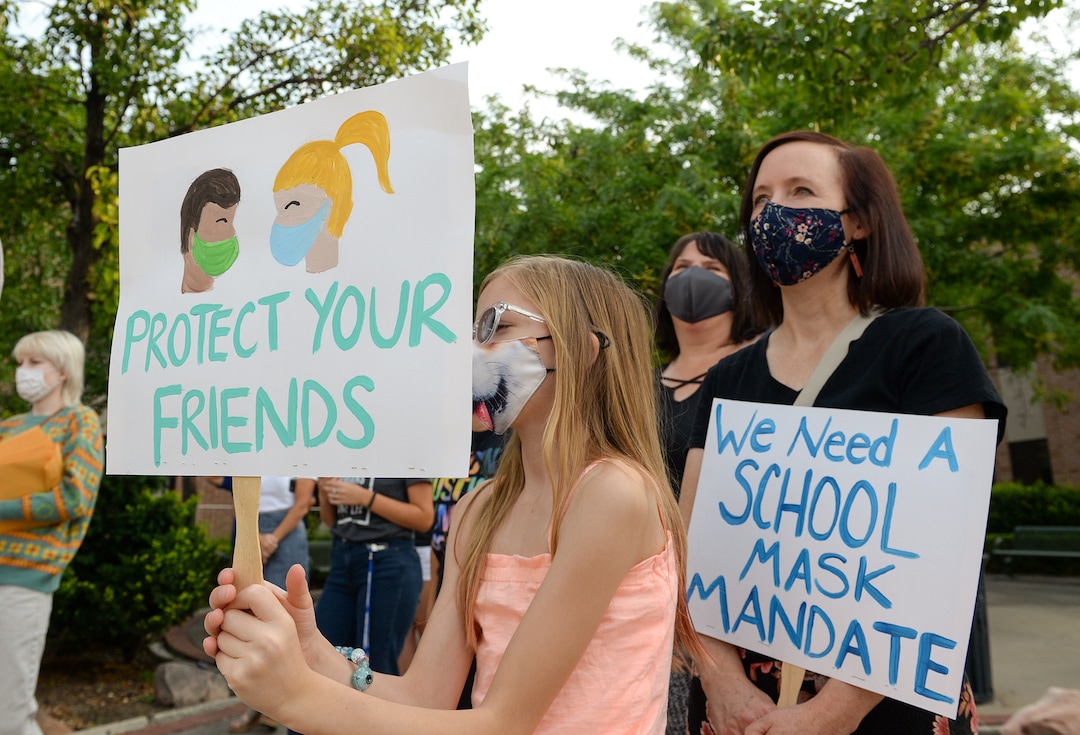 (Chris Samuels | The Salt Lake Tribune) People participate at a rally advocating mask use in schools outside the Utah Board of Education building, Friday, Aug. 6, 2021.