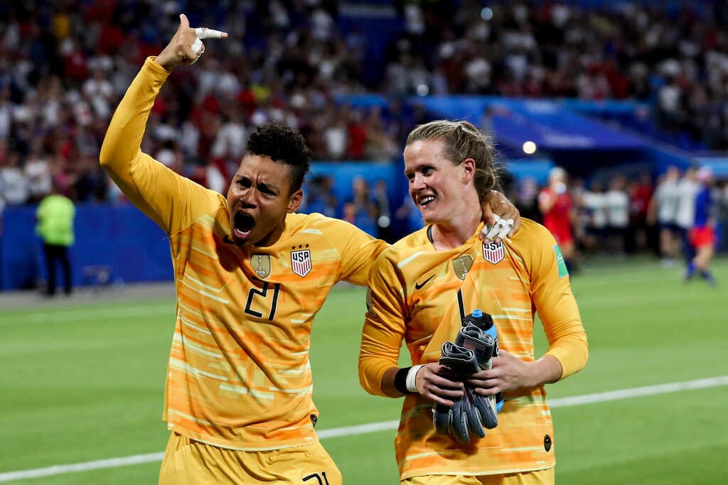United States goalkeepers Adrianna Franch, left, and Alyssa Naeher celebrate after winning the Women's World Cup semifinal soccer match against England, at the Stade de Lyon outside Lyon, France, Tuesday, July 2, 2019. A fan has been accused by a Twitter user of yelling a racial slur at Franch, the goalkeeper of the Portland Thorns, during Friday's loss to Utah Royals FC at Rio Tinto Stadium in Sandy. (AP Photo/Francisco Seco)