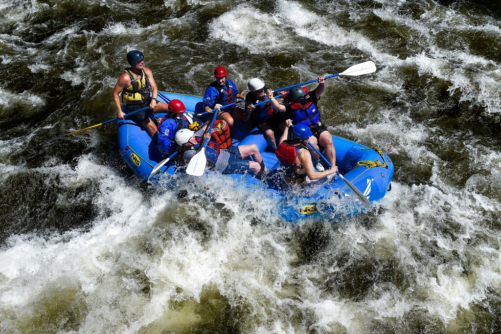 (AP file photo) Rafters navigate high water and big rapids in Bighorn Sheep Canyon on the Arkansas River near Colorado Springs, Colo. On Friday, President Donald Trump overturned an Obama-era order requiring higher pay for employees of outfitting companies with federal permits for excursions on public lands.