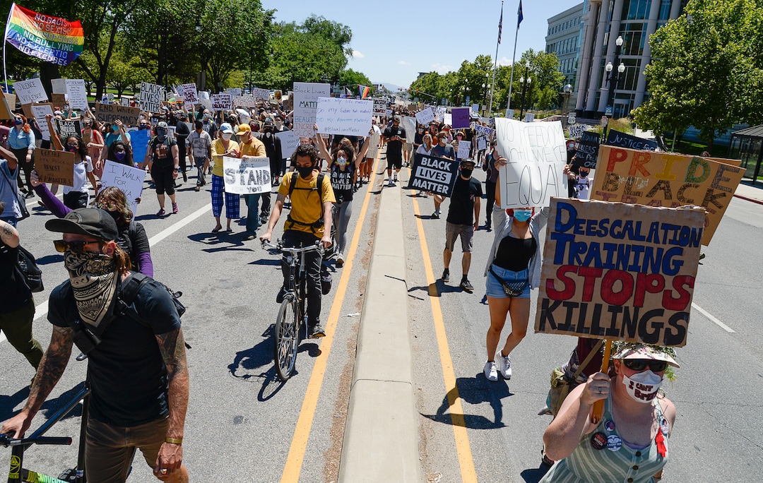 (Francisco Kjolseth  |  The Salt Lake Tribune) Demonstrators march the streets of downtown Salt Lake City for a protest as part of a series of Juneteenth celebrations on Friday, June 19, 2020.
