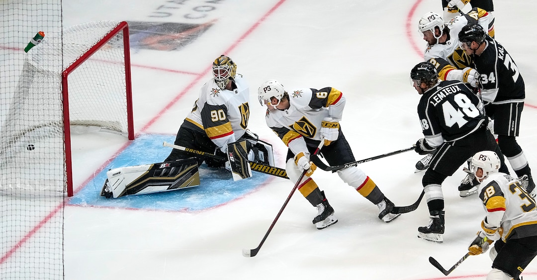 (Leah Hogsten | The Salt Lake Tribune)  Vegas Golden Knights goaltender Robin Lehner (90) and Vegas Golden Knights defenseman Kaedan Korczak (6) watch as Los Angeles Kings left wing Brendan Lemieux (48) hits the net with a goal as the Los Angeles Kings and Vegas Knights meet in a preseason game at Vivint Arena on Sept. 30, 2021.