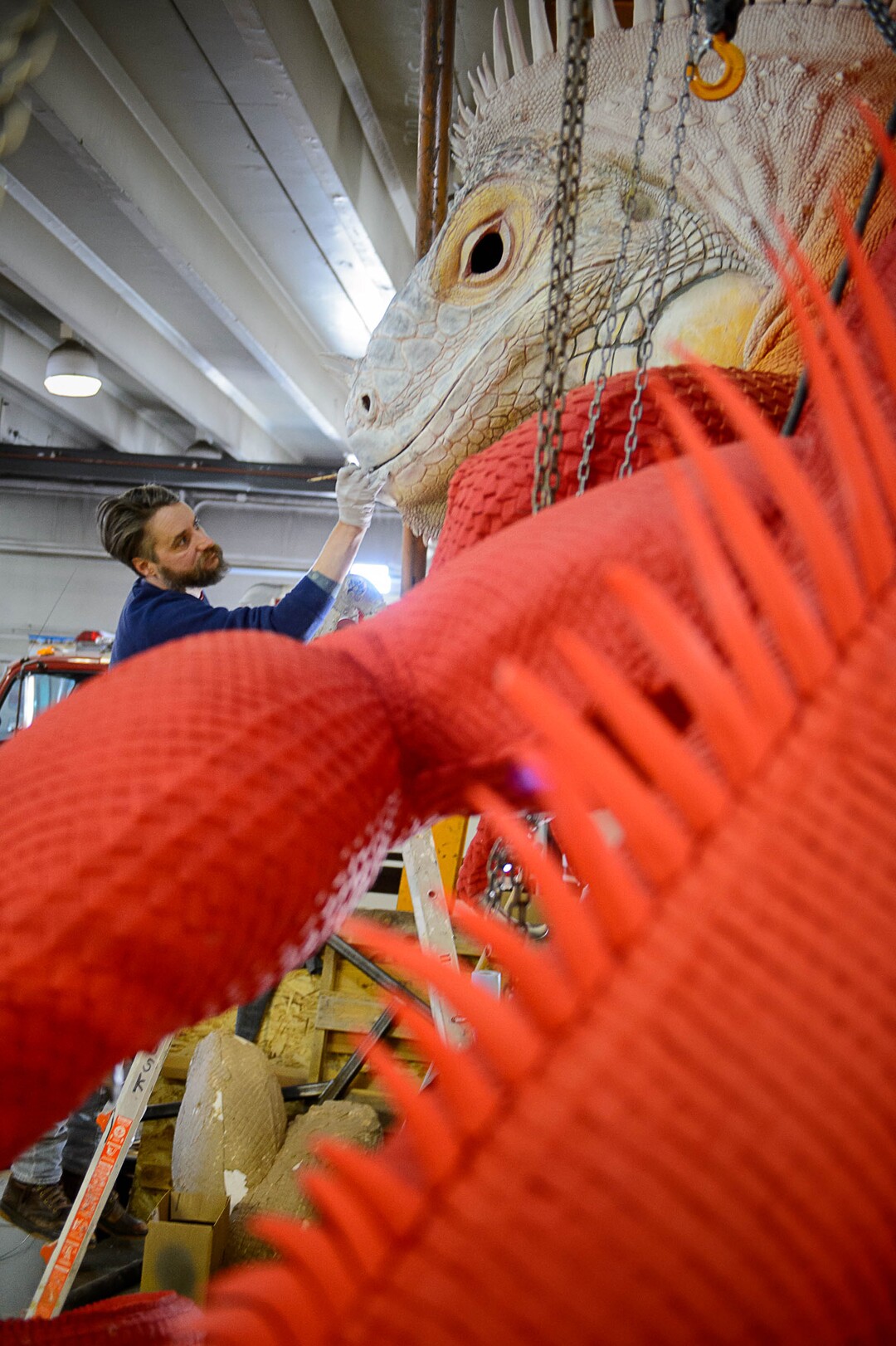 (Trent Nelson | The Salt Lake Tribune)  Artist Stephen Kesler works recently on a giant Red Iguana, to be placed in front of the Salt Lake City restaurant's #2 location. Kesler created the giant whales and other sea creatures for the Living Planet Aquarium. The Red Iguana is 14 feet high and more than 30 feet long.