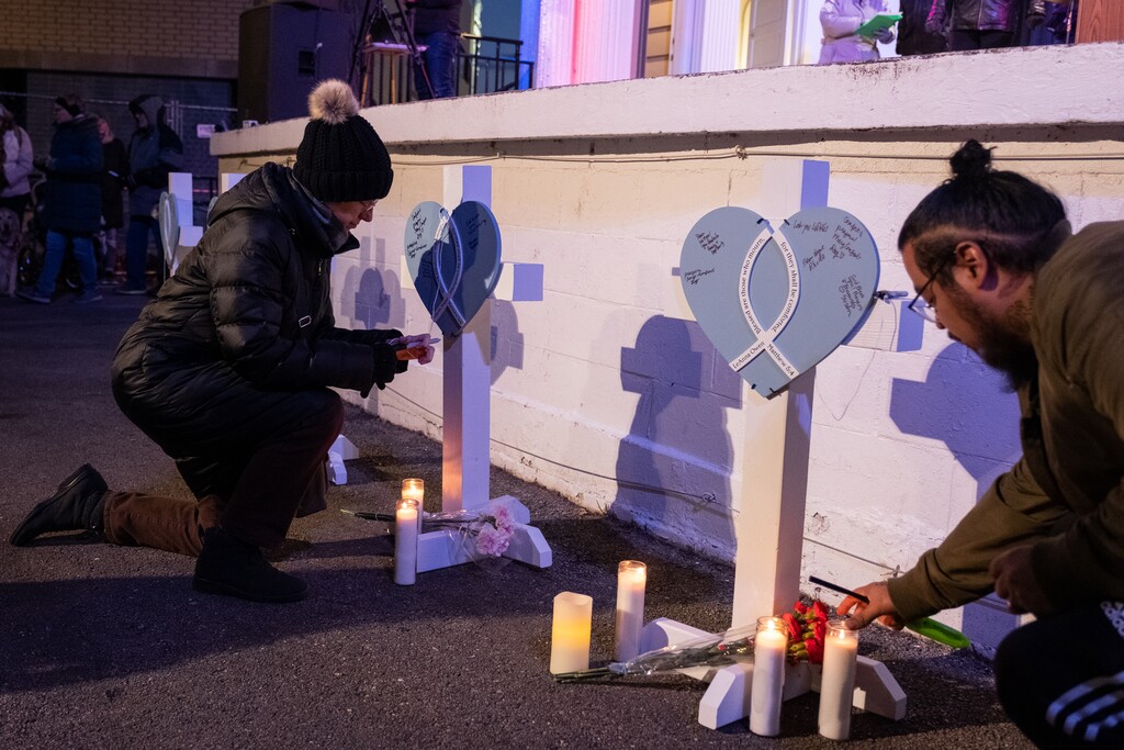 (Mary Mathis | The New York Times)
Mourners gather at a candlelight vigil for the victims of Sunday's parade attack, at Cutler Park in Waukesha, Wis., on Monday, Nov. 22, 2021. The police had a person of interest in custody on Monday after the driver of a red SUV barreled through the parade, killing at least five people and injuring more than 40 others.