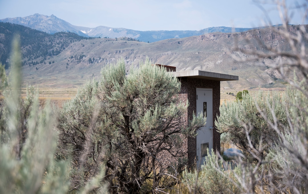 (Eli Imadali  |  Bozeman Daily) The bathroom at McConnel River Access point in the Gallatin National Forest sits among sagebrush along the ChronicleYellowstone River, just outside of Yellowstone National Park. 