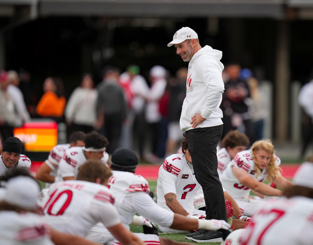 (Bethany Baker  |  The Salt Lake Tribune) Utah Utes head coach Morgan Scalley works with his athletes before the game between the Utah Utes and the Kansas Jayhawks at Rice-Eccles Stadium in Salt Lake City on Saturday, Oct. 10, 2026.