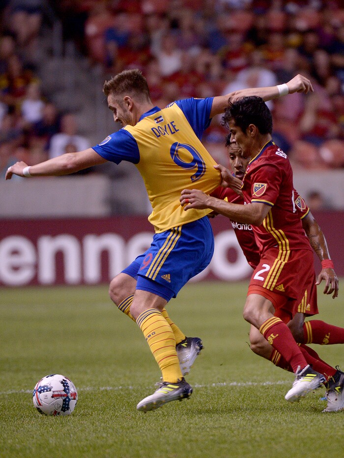 (Leah Hogsten  |  The Salt Lake Tribune) Real Salt Lake defender Tony Beltran (2) battles Colorado Rapids forward Kevin Doyle (9) for the ball.   Real Salt Lake are 1-0 at the half against the Colorado Rapids for the Rocky Mountain Cup at Rio Tinto Stadium, Saturday, August 26, 2017. 