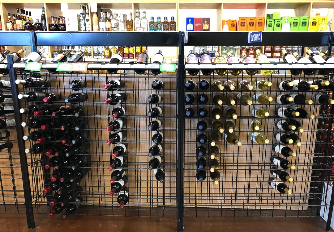 (Francisco Kjolseth  |  The Salt Lake Tribune) The state-run liquor store in Murray has faced some empty shelves and long lines but staff continue to restock product on Tuesday, March 17, 2020. Before Utahns hunker down during the coronavirus, they are stocking up on wine, beer and spirits at state-run liquor stores. Last weekend, the state sold $8 million in alcohol Ñ a total that resembles the day before Thanksgiving or Christmas.