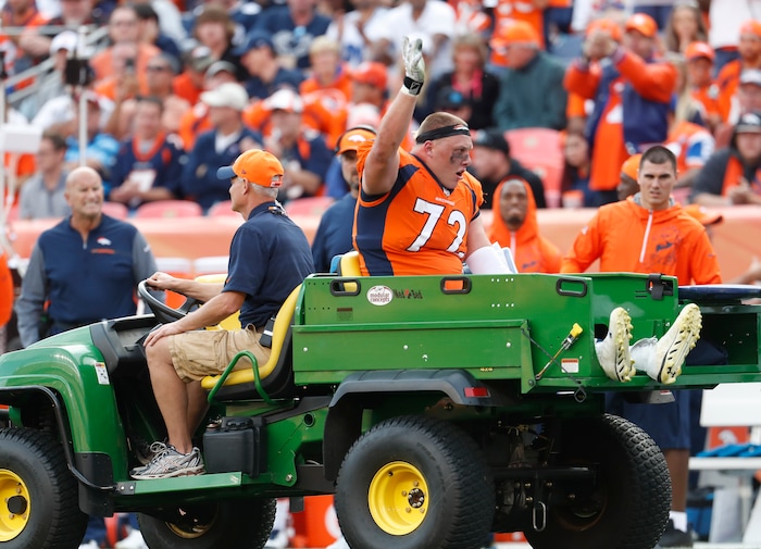 Denver Broncos offensive tackle Garett Bolles (72) is helped off the field after an injury against the Dallas Cowboys during the second half of an NFL football game, Sunday, Sept. 17, 2017, in Denver. (AP Photo/Joe Mahoney)