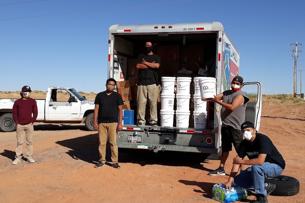 (Courtesy of Louis Williams) Volunteers with Heat Diné Homes organize donated goods for relief efforts on the Navajo Nation.