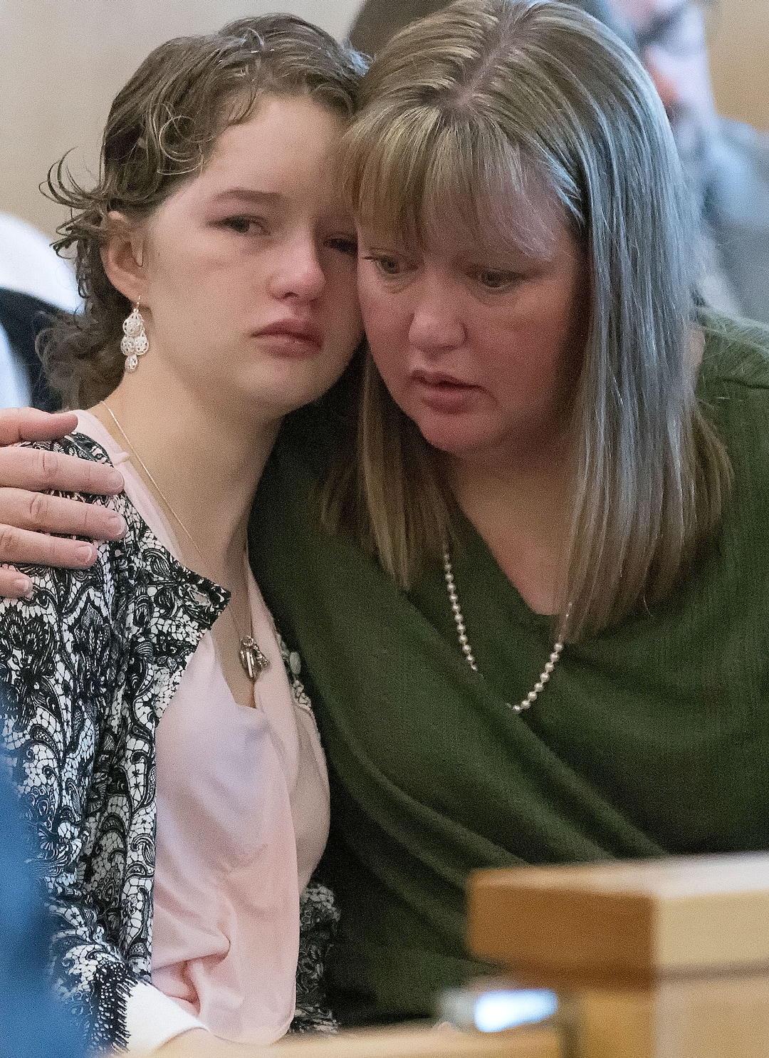 (Eli Lucero  |  Herald Journal, pool) Deserae Turner gets a hug from her mother April Turner during Colter Peterson's sentencing hearing for attempted aggravated murder and robbery, Thursday, Feb. 1, 2018, in Logan, Utah. Peterson received a sentence of 15 years to life for shooting Deserae Turner in February 2017, and leaving her for dead in a dry irrigation canal in Smithfield, Utah.