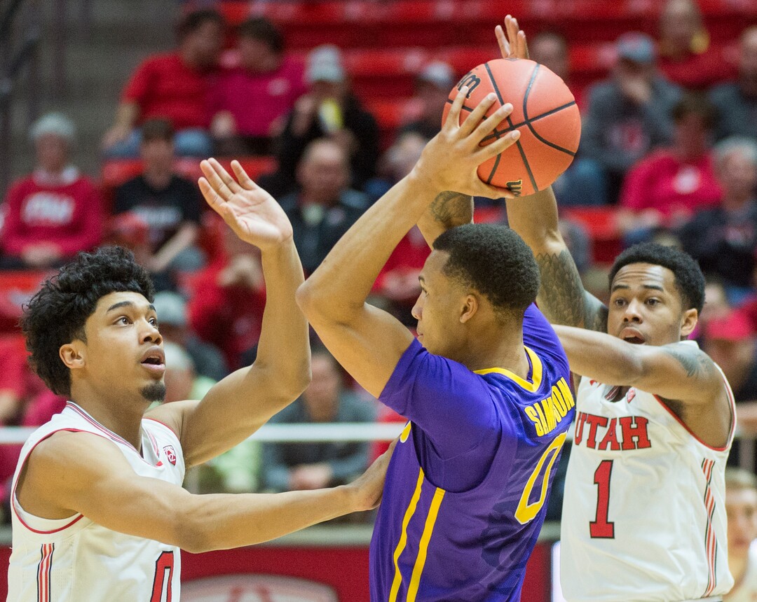 (Rick Egan  |  The Salt Lake Tribune)   Utah Utes guard Sedrick Barefield (0)and Utah Utes guard Justin Bibbins (1) guard LSU Tigers guard Brandon Sampson (0), in NIT playoff action between Utah Utes and LSU Tigers at the Jon M. Huntsman Center, Monday, March 19, 2018.