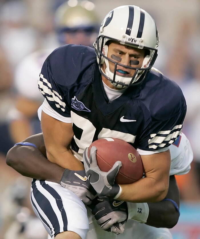 Brigham Young wide receiver Zac Collie (85) is tackled by Tulsa's Nick Graham during the third quarter of a college football game Saturday, Sept. 9, 2006, in Provo, Utah. BYU beat Tulsa 49-24. (AP Photo/George Frey)