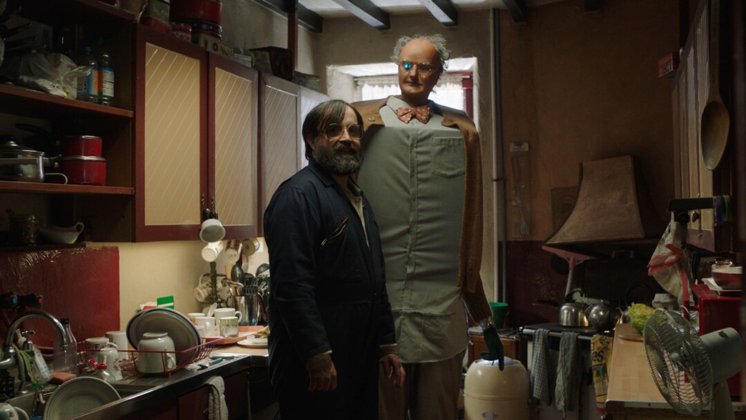 (Sundance Institute) Brian (David Earl) with his robot friend Charles (Chris Hayward), in a scene from the British film "Brian and Charles," directed by Jim Archer, an official selection of the World Cinema Dramatic competition at the 2022 Sundance Film Festival.