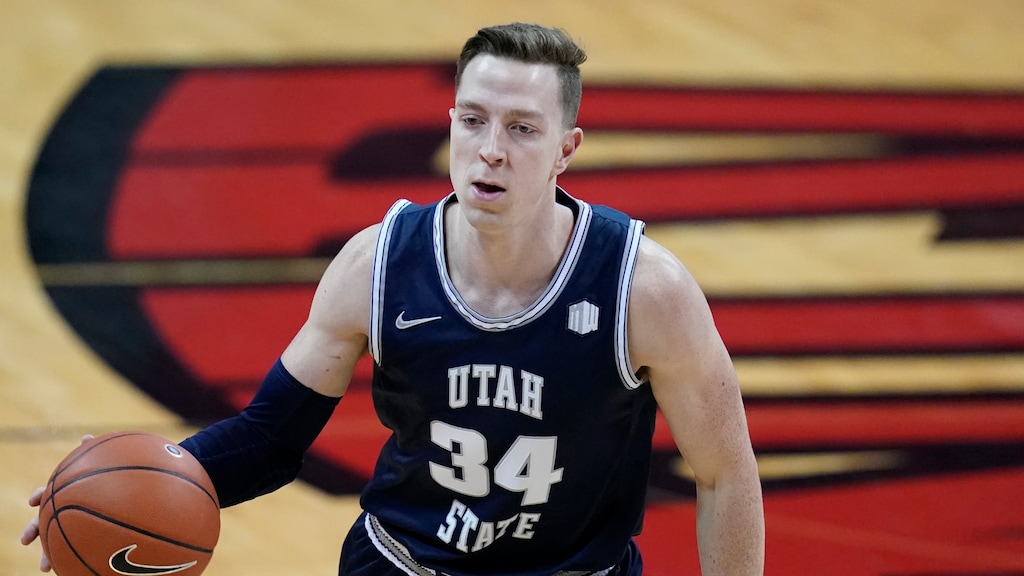 (John Locher | AP) Utah State's Justin Bean (34) plays against UNLV in an NCAA college basketball game Wednesday, Jan. 27, 2021, in Las Vegas. This season, Bean ranks in the top 10 nationally in both scoring and rebounding.