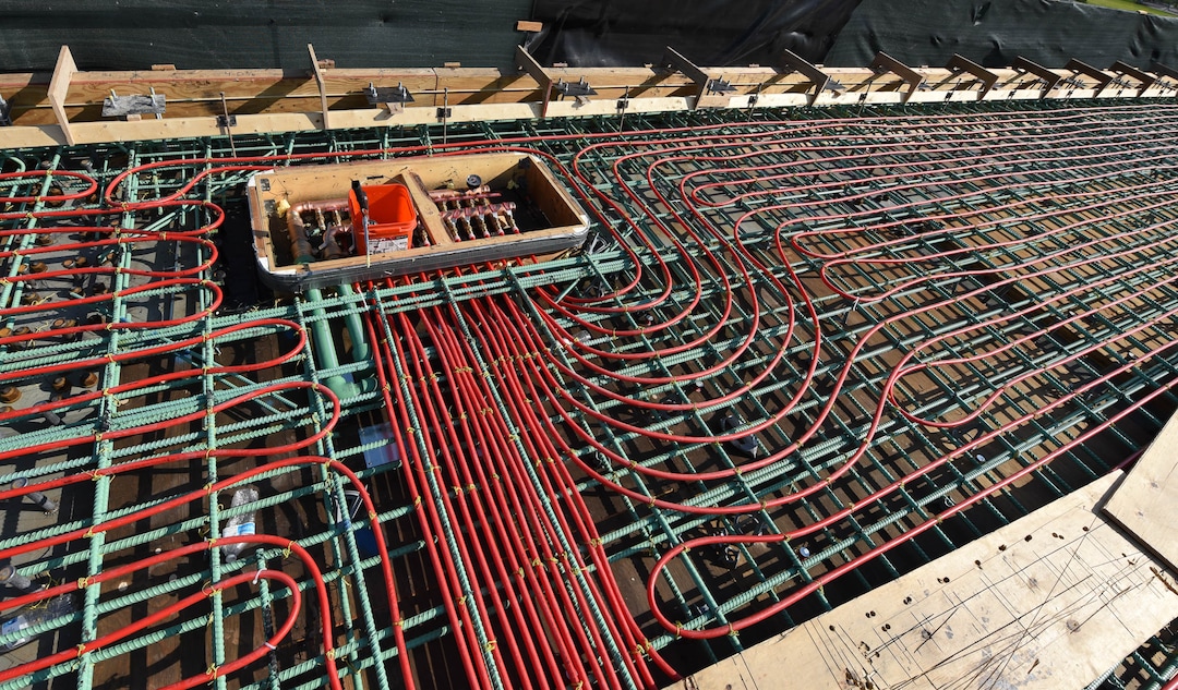 (Francisco Kjolseth  |  The Salt Lake Tribune) UDOT gives a tour of the state’s new longest pedestrian bridge on Thursday, August 20, 2020, connecting Utah Valley University in Orem to student housing and the community on the West side of I-15. Crews are finishing up an extensive hydronic heating system that will pump warm water to keep the bridge clear of snow in the winters, as it gets ready to pour concrete for the walking surface. UDOT will close I-15 in both directions this weekend for work on the nearly 1,000 foot bridge that is 15 feet wide to accommodate pedestrians, cyclists and scooters. Elevators and stairs with small ramps to push up bicycles will be on each side of the bridge.