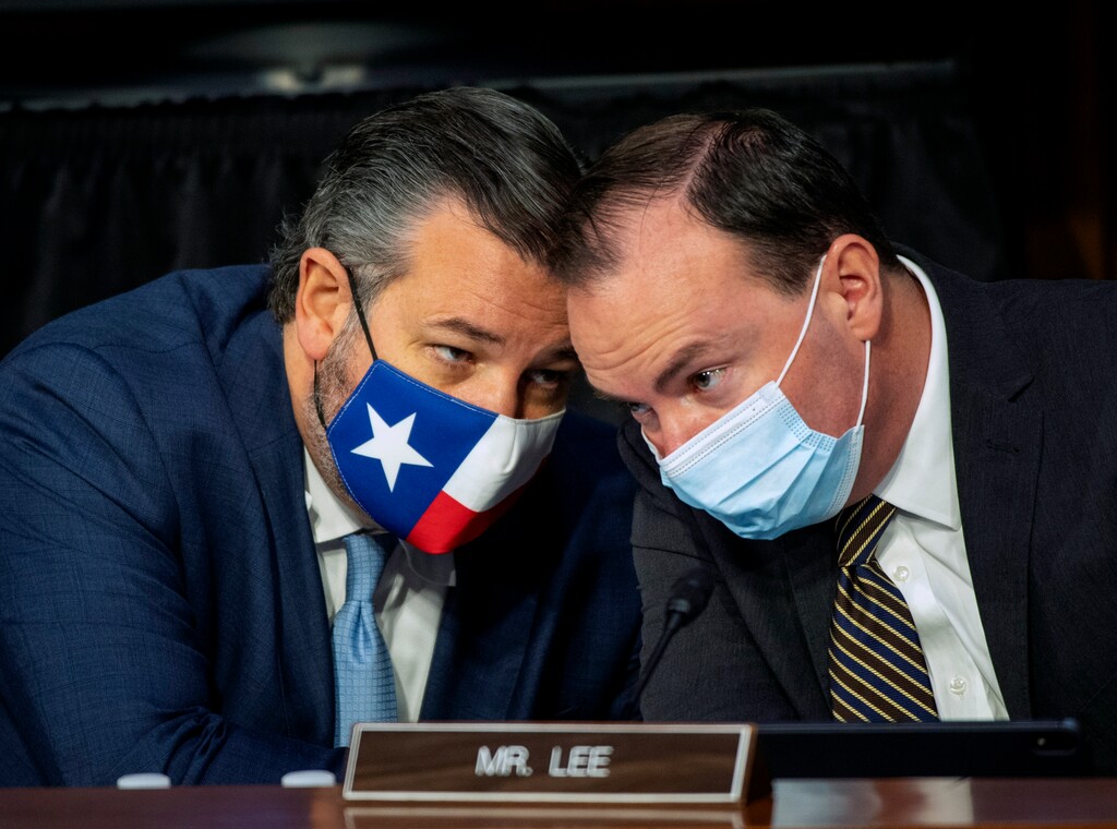 (Bill O'Leary | Pool) Sen. Ted Cruz, R-Texas, left, speaks with Sen. Mike Lee, R-Utah, during the confirmation hearing for Supreme Court nominee Amy Coney Barrett, before the Senate Judiciary Committee, Thursday, Oct. 15, 2020, on Capitol Hill in Washington.