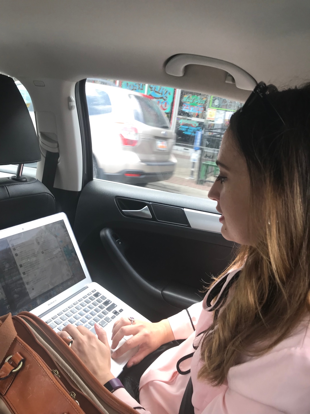 (Kolbie Peterson | The Salt Lake Tribune) Digital News Editor Rachel Piper complains on Slack that her Lyft driver has taken her in a circle.