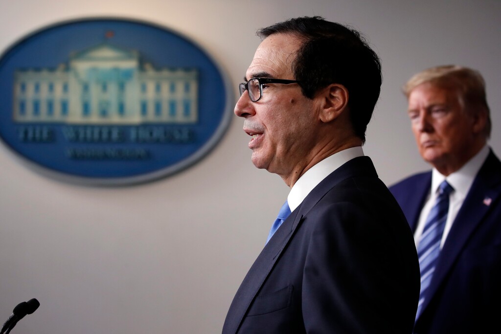 (Alex Brandon | AP file photo)  President Donald Trump listens as Treasury Secretary Steven Mnuchin speaks about the coronavirus in the James Brady Press Briefing Room of the White House in Washington on April 21, 2020.