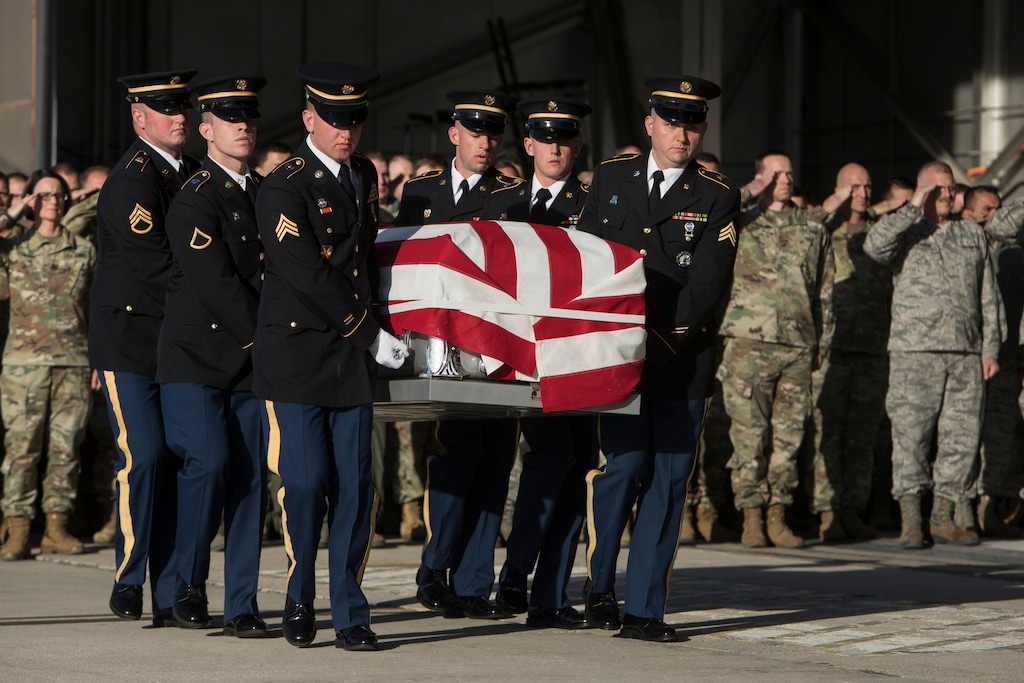 (Matt Herp | Standard-Examiner via AP Pool, file) In November 2018, Utah National Guard Honor Guard carry a casket containing the remains of Maj. Brent R. Taylor at the National Guard base, in Salt Lake City. Taylor's widow, Jennie Taylor, has pushed the plans for a proposed Gold Star Families Monument.