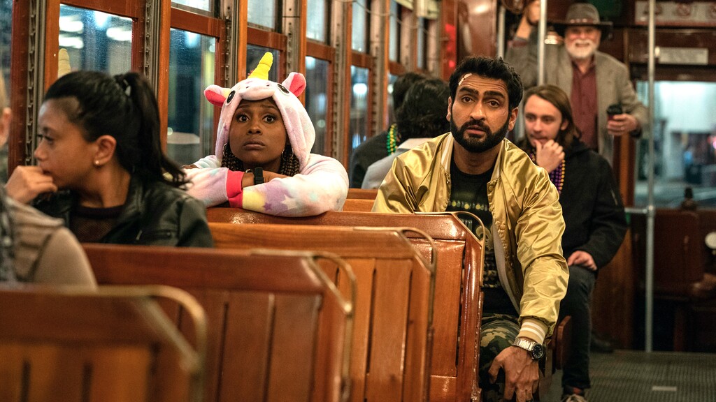 (Photo courtesy of Skip Bolen/Netflix) Leilani (Issa Ray) and Jibran (Kumail Nanjiani) are trying to escape on a New Orleans street car in “The Lovebirds.”