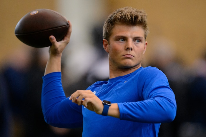 (Trent Nelson | The Salt Lake Tribune) BYU quarterback Zach Wilson warms up before working out for NFL scouts during BYU Pro Day, in Provo on Friday, March 26, 2021.