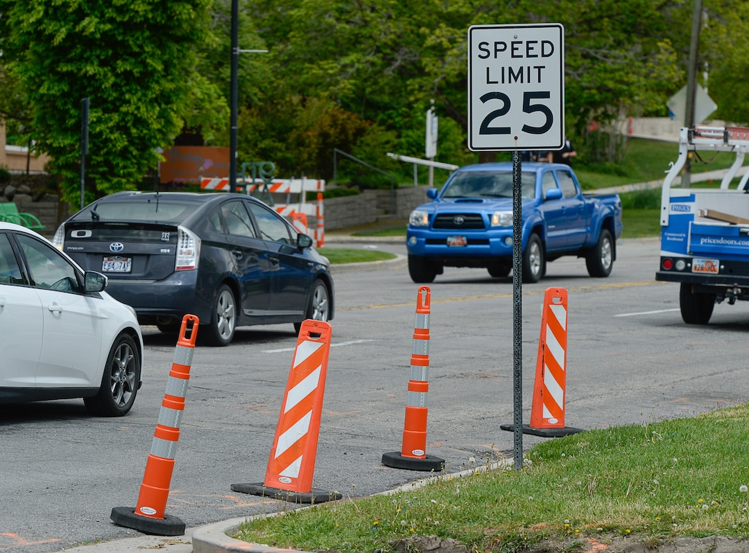 (Francisco Kjolseth  |  The Salt Lake Tribune)  Traffic moves along a sea of orange as plans to repurpose 29 parking spaces between 950 East and 1300 East on 900 South in Salt Lake City causes some frustration from business owners and residents in the area.