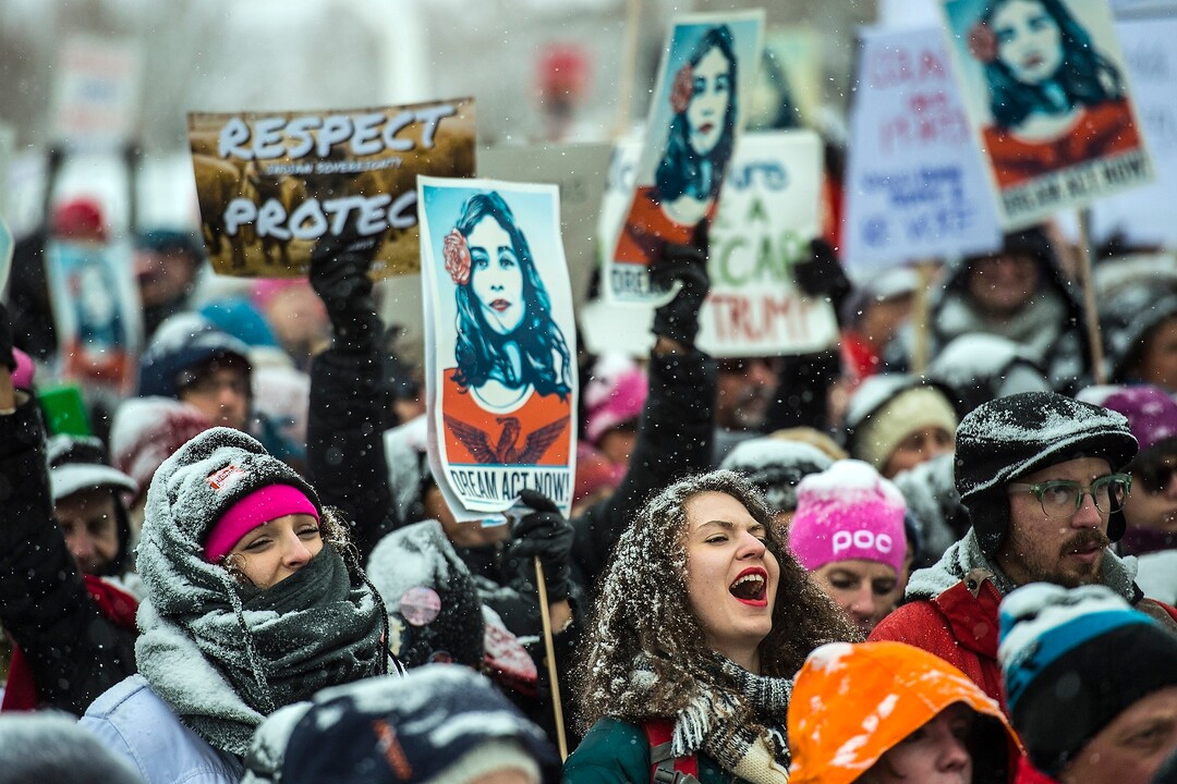 (Chris Detrick  |  The Salt Lake Tribune)  People hold signs and cheer during the Respect Rally Park City at City Park on Saturday, Jan. 20, 2018.