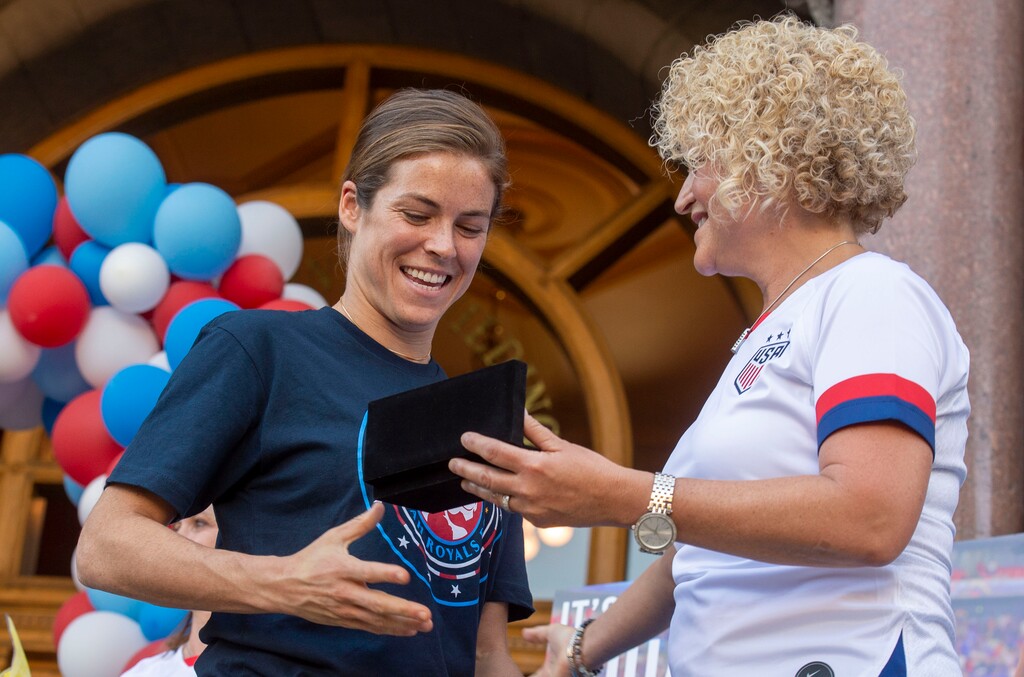 (Rick Egan  |  The Salt Lake Tribune)    Kelley O'Hara, shakes hands with Salt Lake City Mayor Jackie Biskupskie, as she is given a key to the city, as the Mayor honors Royals FC, and US National Women's soccer team players, Christen Press, Becky Sauerbrunn and Kelley O'Hara, during a ceremony honoring her for them for their part in the US National Women's World Cup win, at the City and County Building, Monday, July 22, 2019.