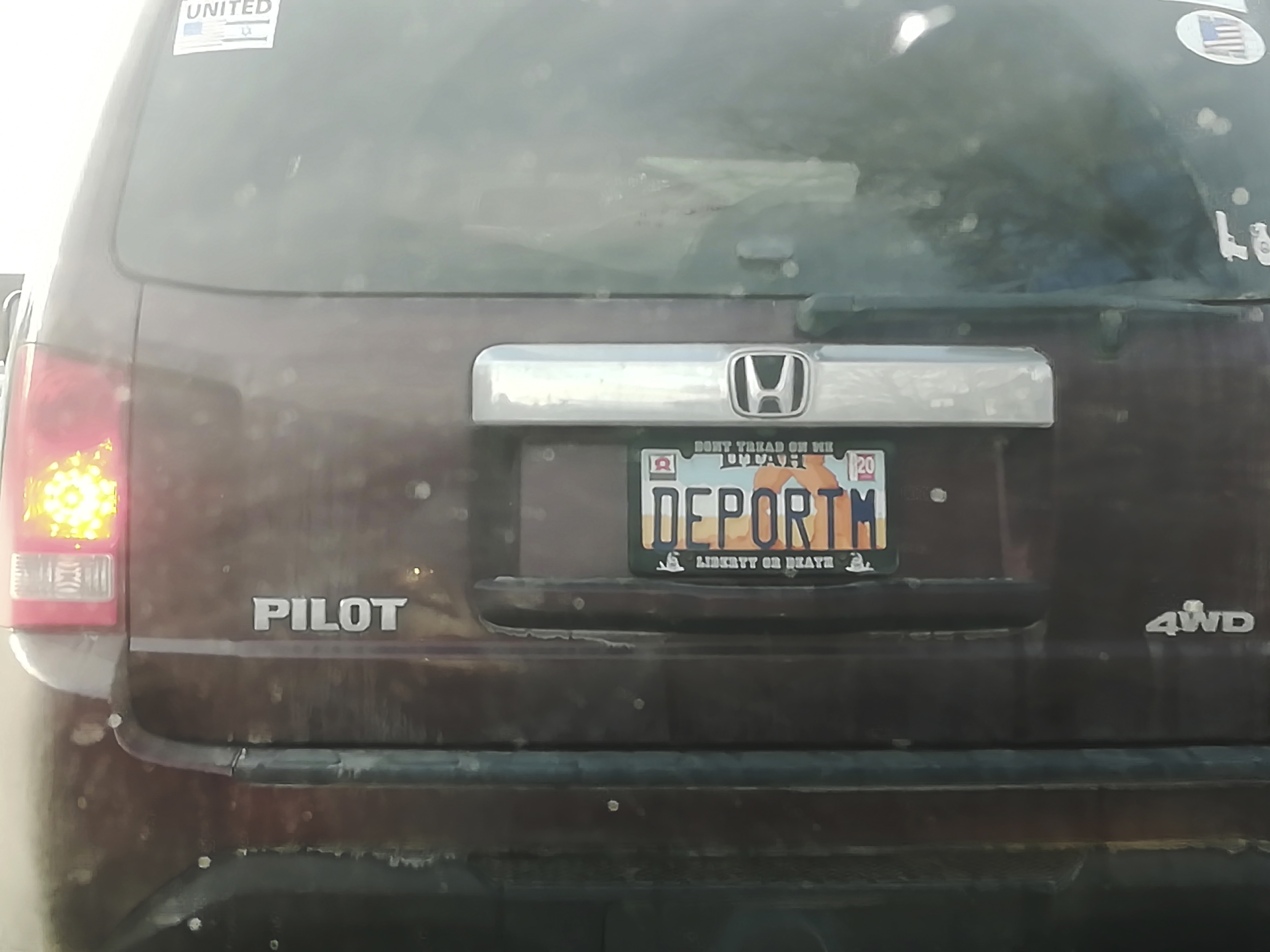 (Matt Pacenza via AP) This undated photo provided by Matt Pacenza shows a license plate on a vehicle. Utah lawmakers want to know how a license plate with the phrase "DEPORTM" got approved despite rules against expressing contempt for any race, religion or political opinion on vanity plates.