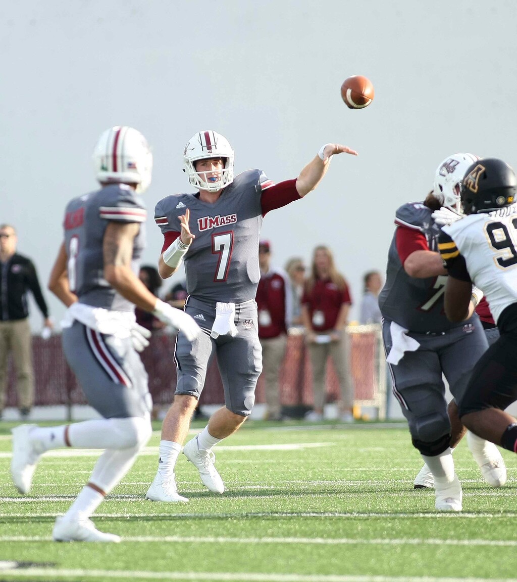 UMass quarterback Andrew Ford launches a pass to Sadiq Palmer on a crossing route in the first half of an NCAA college football game against Appalachian State in Amherst, Mass., Saturday, Oct. 28, 2017.  (J. Anthony Roberts/The Republican via AP)