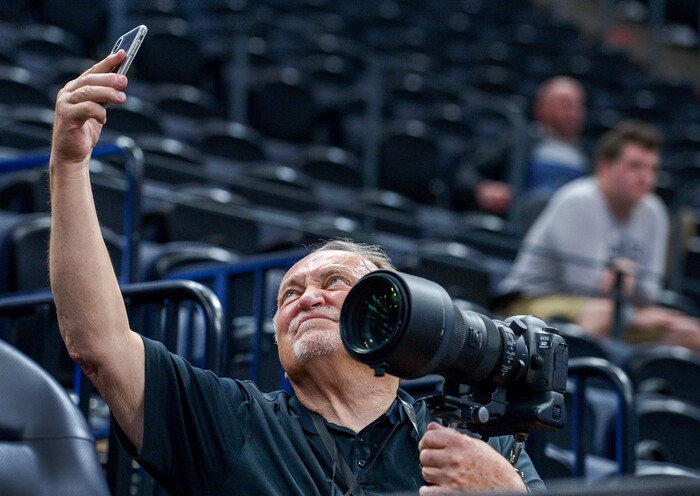 Leah Hogsten  |  The Salt Lake Tribune  Independent sports photographer Barry Judd of Salt Lake City snaps a selfie while shooting Auburn's practice prior to Thursday's  2019 NCAA Division I Men's Basketball Championship's first round games. 
