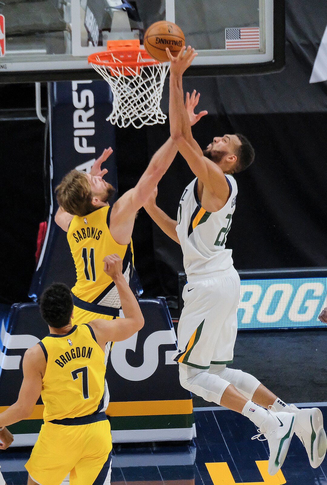 Leah Hogsten | The Salt Lake Tribune  Utah Jazz center Rudy Gobert (27) and Indiana Pacers forward Domantas Sabonis (11) at the net as the Utah Jazz host the Indiana Pacers, April 16, 2021 at the Vivint Arena.