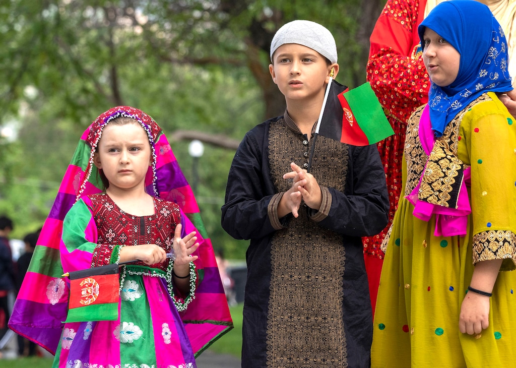 (Rick Egan | The Salt Lake Tribune) 
Muhammad-Ali Mustafawi, Aiza Mustafawi and Arya Mustafawi gather at Murray Park for a prayer vigil in honor of Utah's Afghan refugees, onSaturday, Aug. 21, 2021.