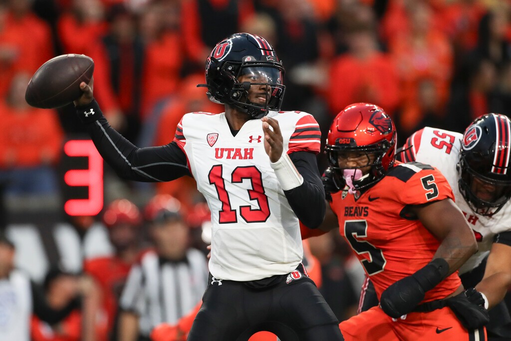 (Amanda Loman | AP) Utah quarterback Nate Johnson (13) drops back to pass against Oregon State during the first half Friday in Corvallis, Ore.