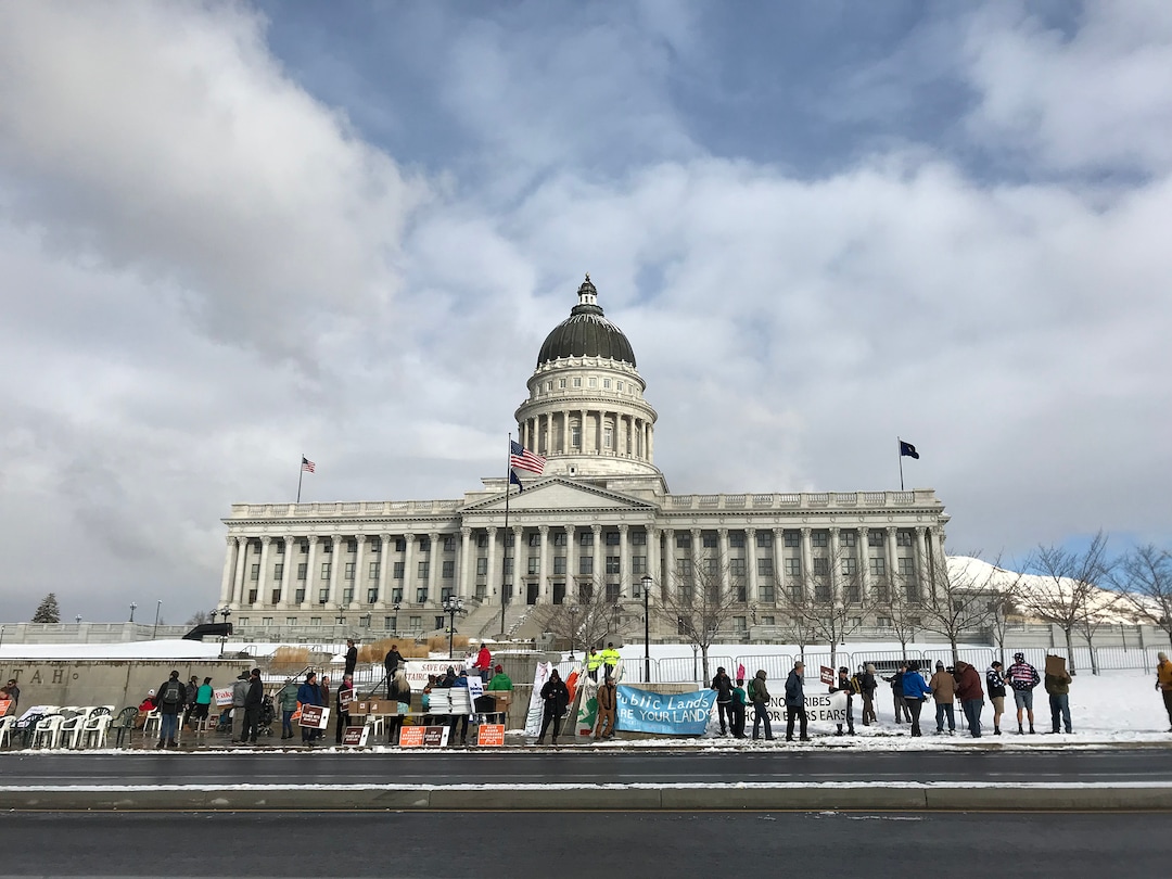 (Rachel Molenda  |  The Salt Lake Tribune) Protesters start to gather outside the Utah State Capitol ahead of President Donald Trump's speech where he is expected to sign an executive order reducing the size of Bears Ears and Grand Staircase - Escalante National Monuments.