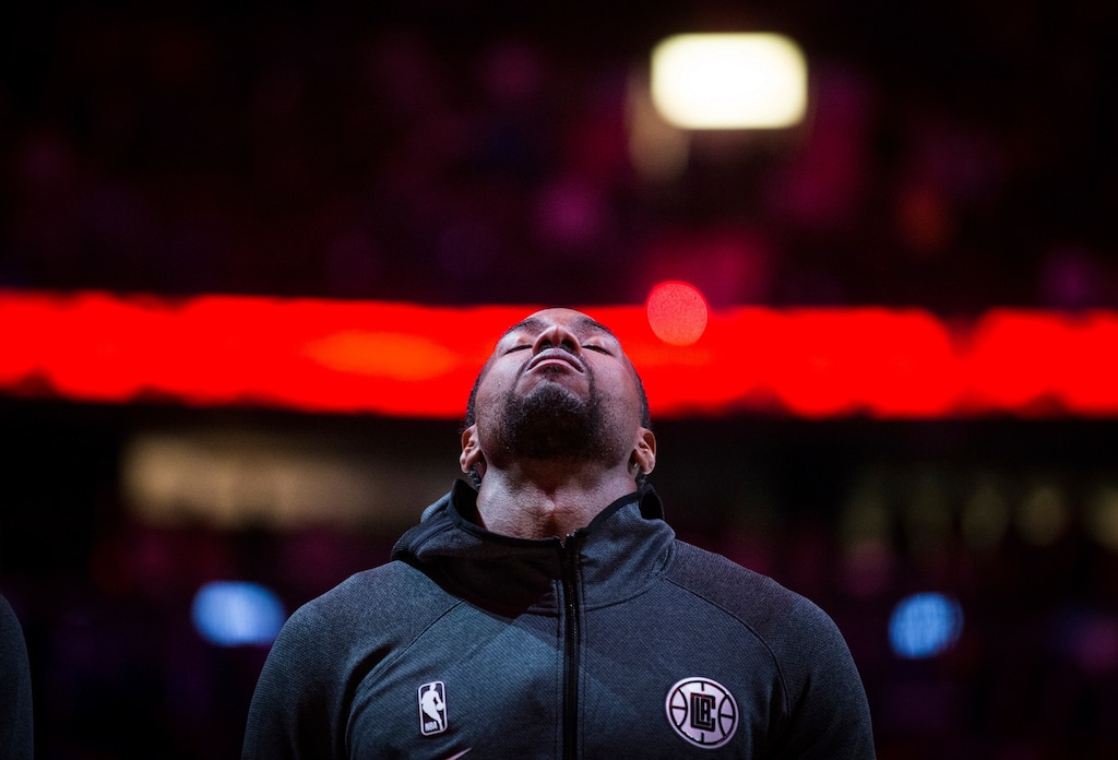 Los Angeles Clippers' Kawhi Leonard stands during the national anthems before the team's NBA preseason basketball game against the Dallas Mavericks on Thursday, Oct. 17, 2019, in Vancouver, British Columbia. (Darryl Dyck/The Canadian Press via AP)