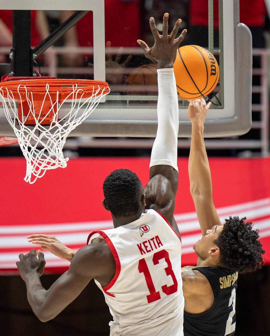 (Rick Egan | The Salt Lake Tribune) Utah Utes center Keba Keita (13) blocks a shot by Colorado Buffaloes guard KJ Simpson (2), in PAC-12 basketball action between the Utah Utes and the Colorado Buffaloes a the Jon M. Huntsman Center, on Saturday, Feb. 3, 2024.