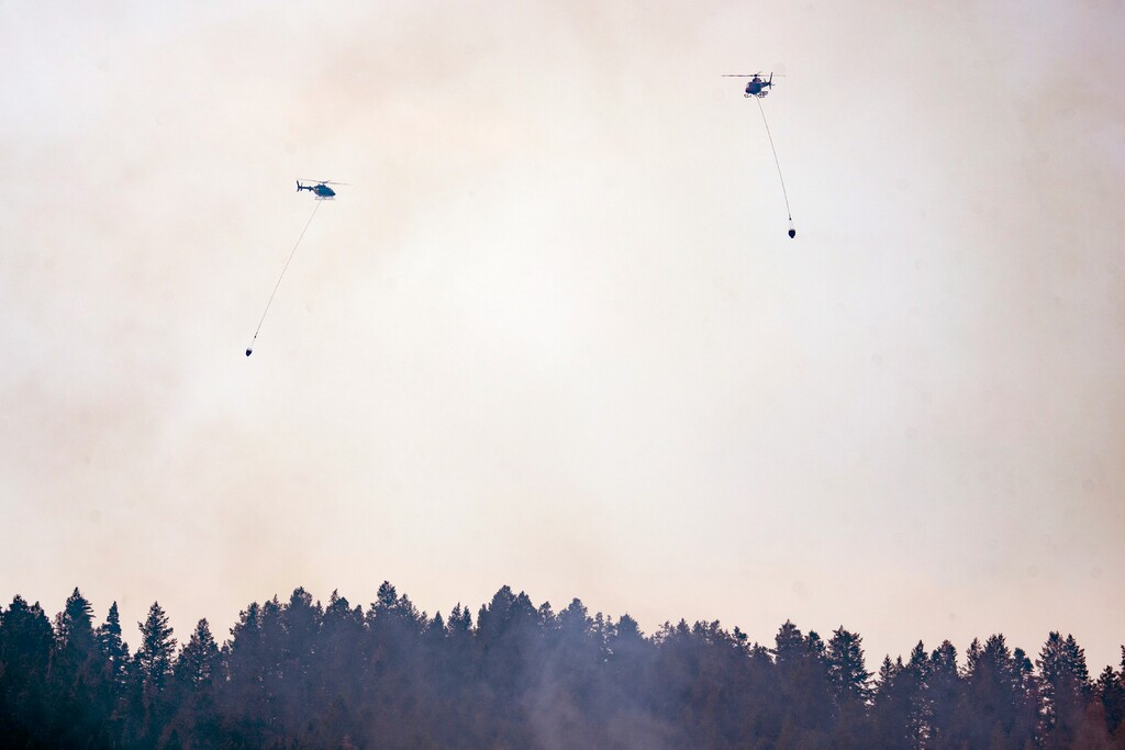 (Rick Egan | The Salt Lake Tribune) Helicopters carry water to fight the Parleys fire, on Sunday, Aug. 15, 2021.