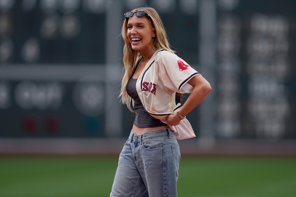 (Charles Krupa | Associated Press file photo) Social media influencer and podcaster Alex Cooper — seen here throwing out the first pitch at Boston's Fenway Park in 2024 — will host and produce a sports competition show to be shot in Park City, the Utah Film Commission says.