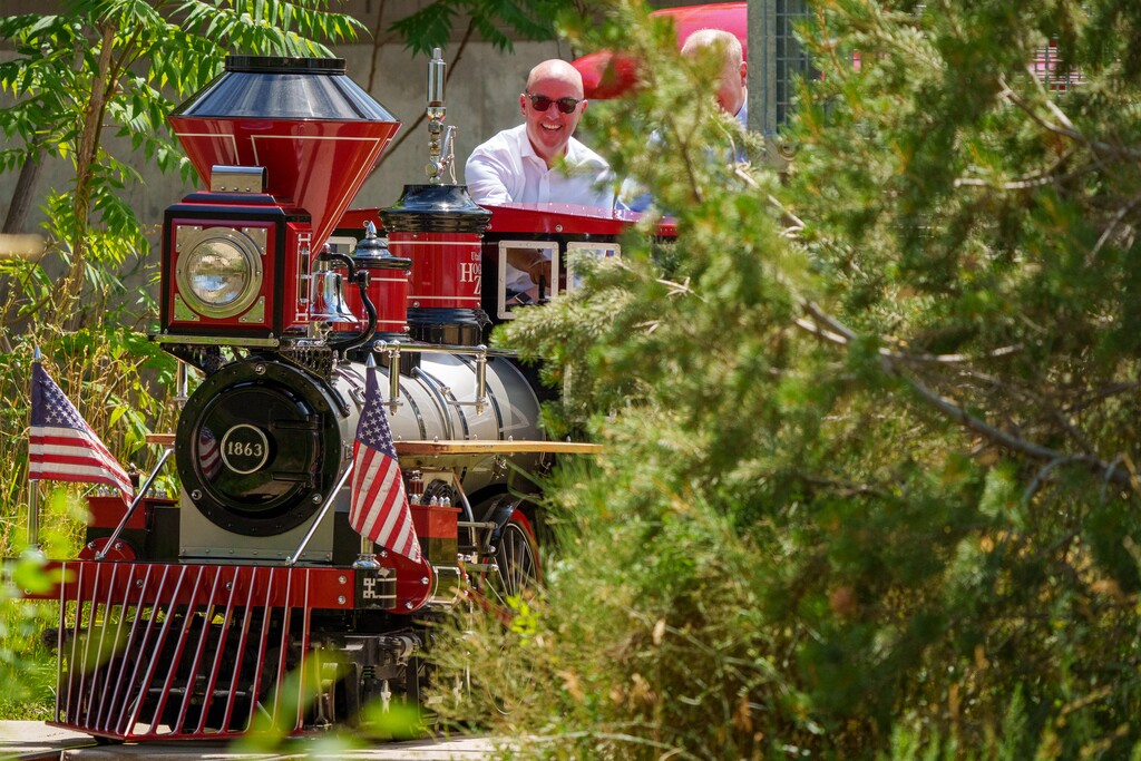 (Trent Nelson  |  The Salt Lake Tribune) Gov. Spencer Cox pilots the Zoofari Express Train at Hogle Zoo in Salt Lake City on Wednesday, Aug. 10, 2022. Cox said he is still interested in looking into the possibility of a train route connecting Salt Lake City to Boise and Las Vegas after federal officials declined to pay for studying the proposal.