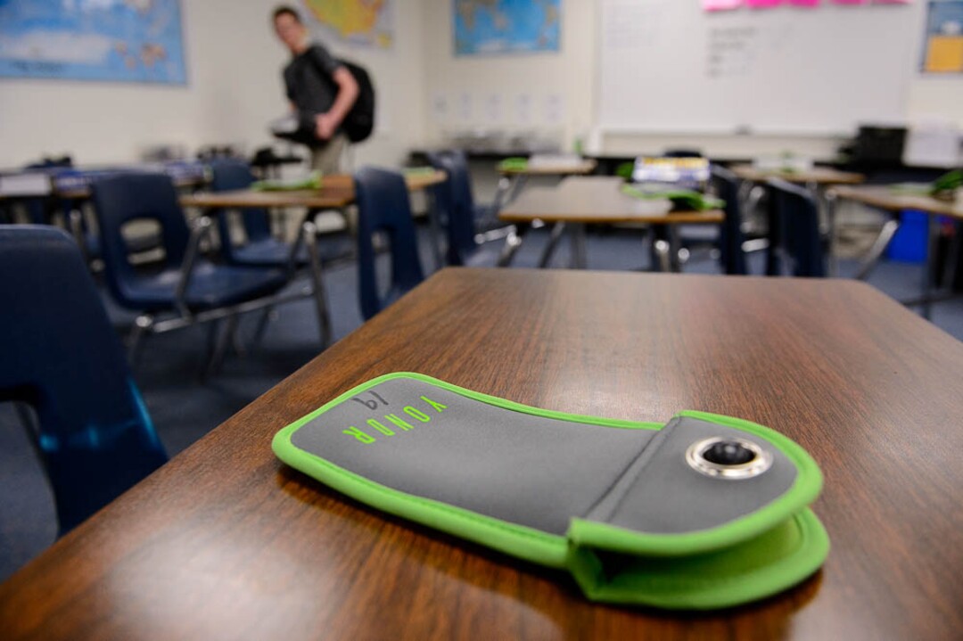 (Trent Nelson | The Salt Lake Tribune) Students in Monta Thomas' classes at Brighton High School in Cottonwood Heights secure their phones in locking pouches made by Yondr.