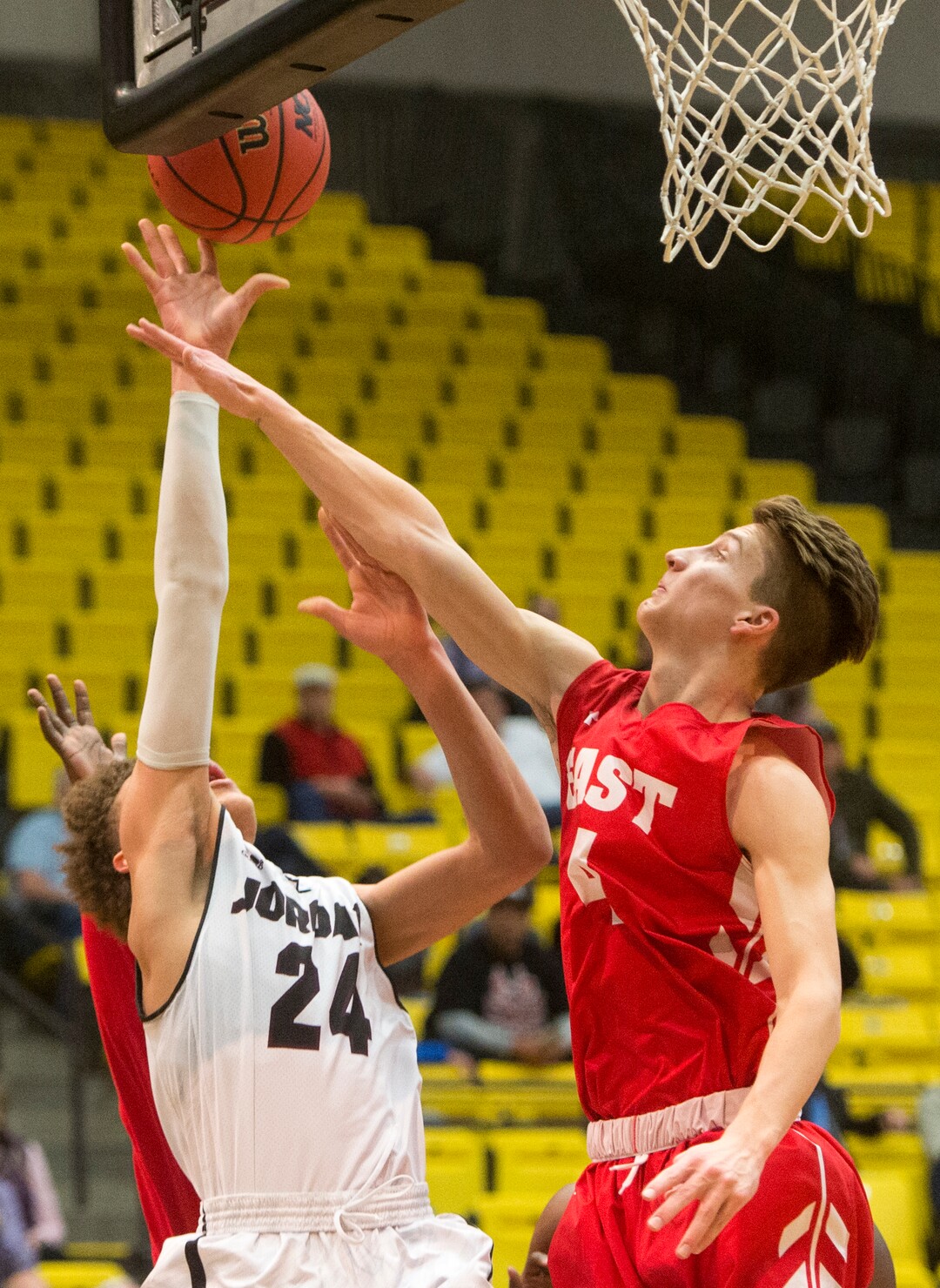 (Rick Egan  |  The Salt Lake Tribune)  Jordan Beatdiggers Terryn Mosley, takes a shot as East Leopards Taylor Zwick (4) defends, in 5A basketball playoff action between the East Leopards and the Jordan Beatdiggers at the UCCU Center in Orem, Monday, Feb. 26, 2018.